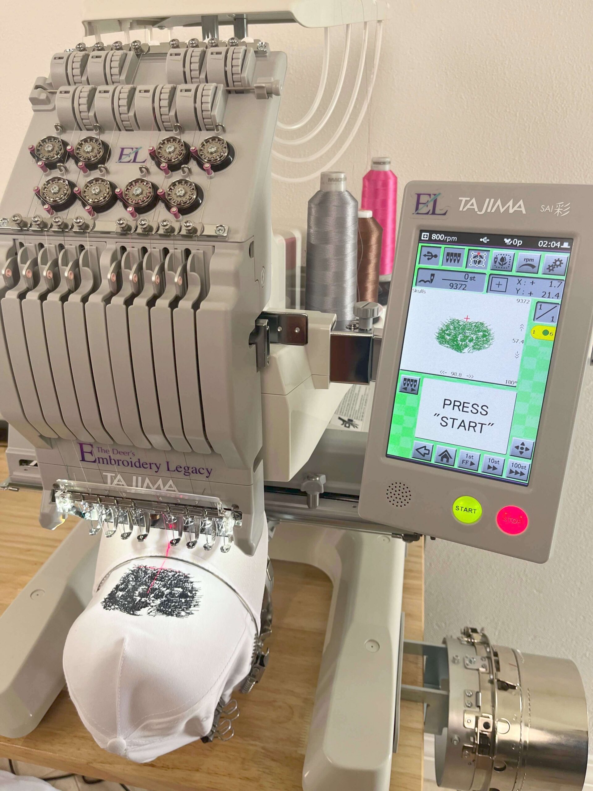 Tajima embroidery machine with hat frame